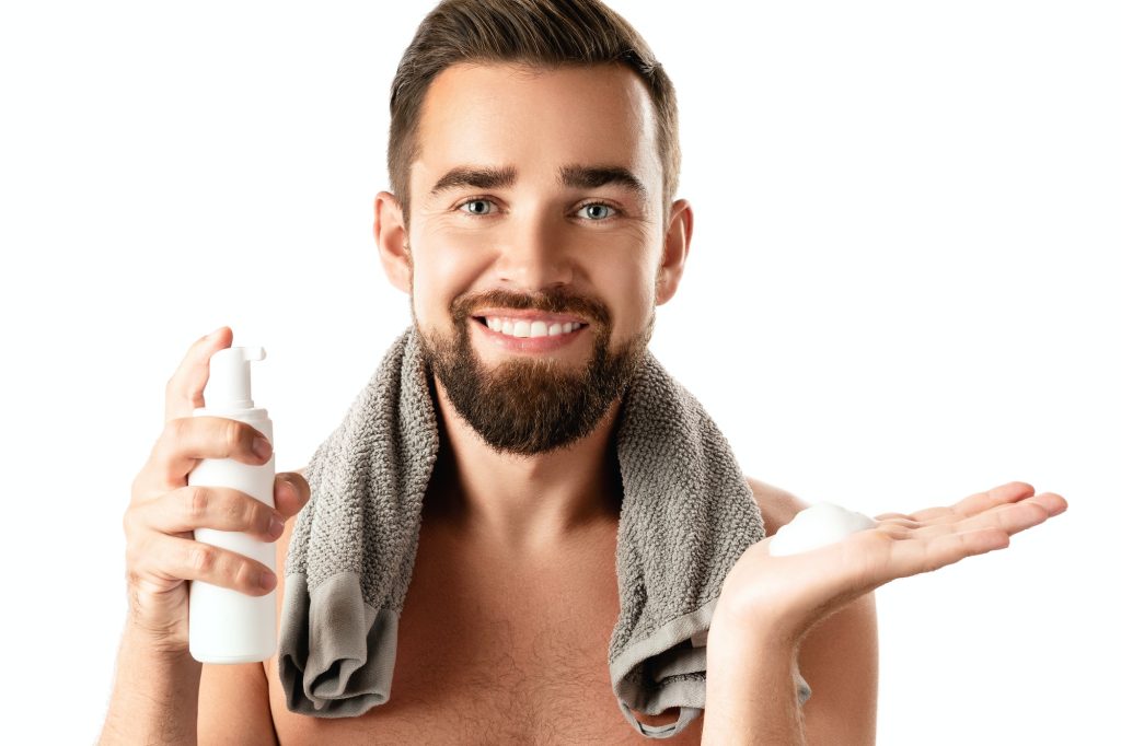 Handsome man with a cleansing or shaving foam