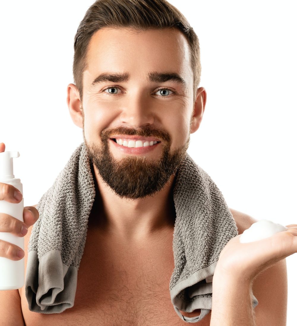 Handsome man with a cleansing or shaving foam