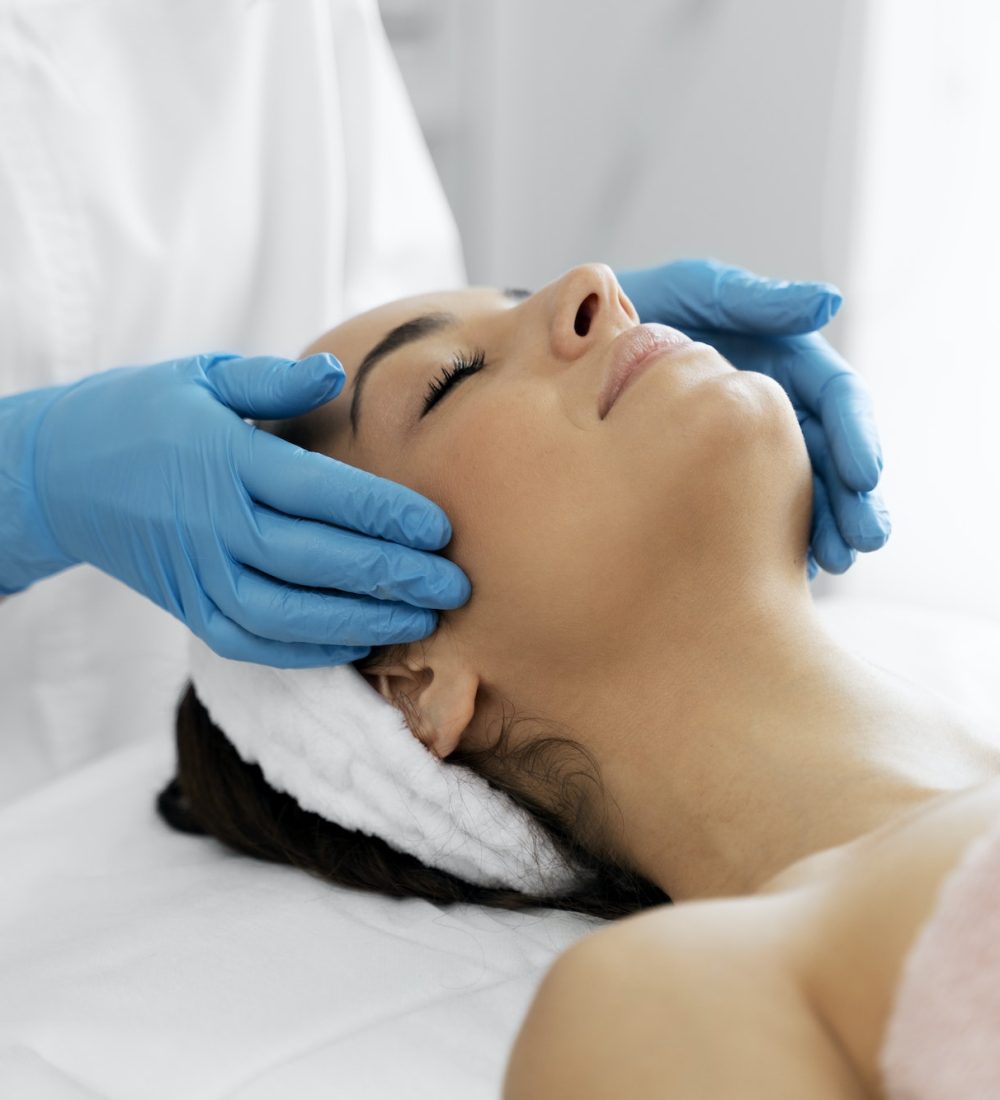 Pleasant beauty procedure with soft face massage performed by the professional therapist