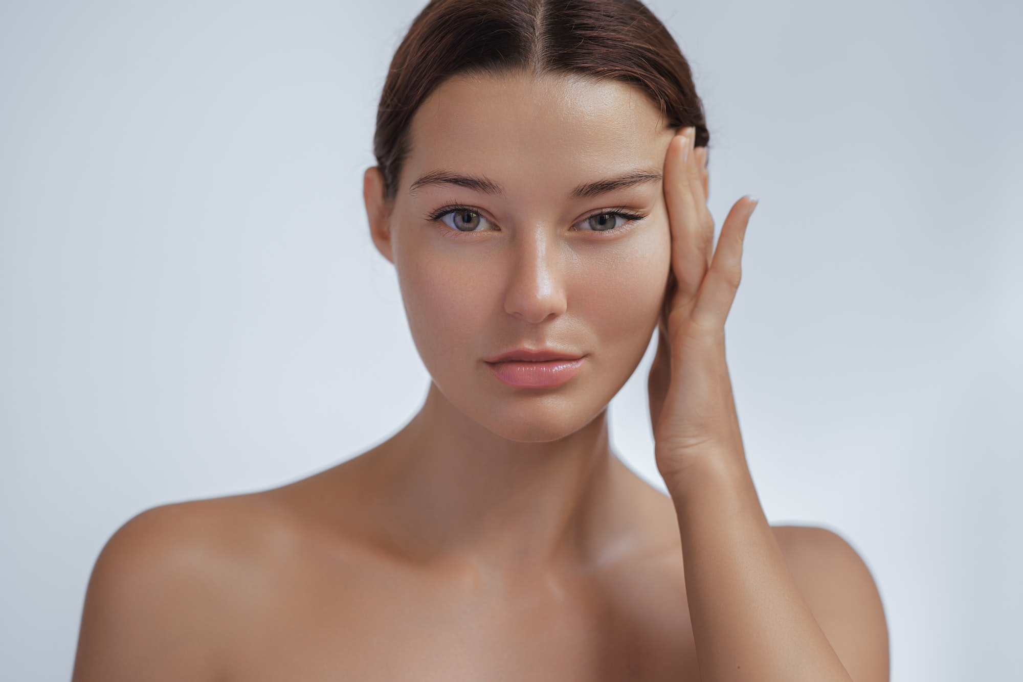 Anti Aging Treatment and Facelift Skin Care Concept. Woman with hand on cheek and eye